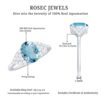 Rosec Jewels solitaire 1 carat aquamarine oval engagement ring with diamond cluster setting and silver band.