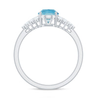 Rosec Jewels solitaire 1-carat aquamarine oval engagement ring with diamond cluster setting on a white background.