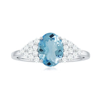 Solitaire 1 Carat aquamarine oval engagement ring with diamond cluster by Rosec Jewels, featuring a detailed view of the ring design.