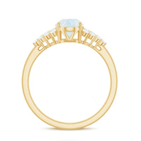 Oval cut moonstone solitaire ring with diamond accent from Rosec Jewels, showcasing a shimmering moonstone and elegant band.