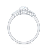 Oval moissanite engagement ring with 6x8mm stone and cluster side stones, featuring a Rosec Jewels design.