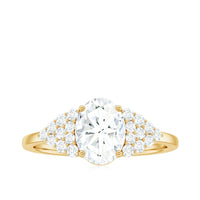 Oval moissanite engagement ring with 6x8mm center stone and cluster side stones, crafted by Rosec Jewels.