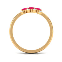 Oval ruby three-stone promise ring with diamonds by Rosec Jewels, featuring a central ruby flanked by two diamonds.