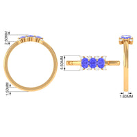Oval cut Tanzanite three-stone ring with diamonds from Rosec Jewels, showcasing the gemstone and elegant band design.