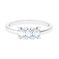 Oval cut moonstone three-stone ring with diamonds from Rosec Jewels, showcasing the elegant design and sparkling gemstones.