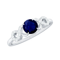 Real 0.9 carat blue sapphire infinity promise ring with diamonds, Rosec Jewels, showcasing a silver band with blue sapphire and diamond accents.