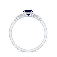 Real 0.9 carat blue sapphire infinity promise ring with diamond, featuring a silver band and intricate design.