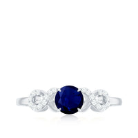 Real 0.9 carat blue sapphire infinity promise ring with diamonds, Rosec Jewels, showcasing a elegant silver band and sparkling gemstones.