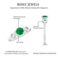 Real emerald diamond promise engagement ring with a criss-cross shank, featuring emerald and diamond accents, by Rosec Jewels.