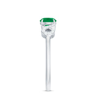 Emerald diamond promise engagement ring with criss-cross shank from Rosec Jewels, showcasing a central emerald and sparkling diamonds.