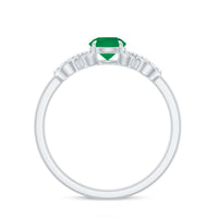 Elegant real emerald diamond engagement ring with a criss-cross shank, featuring sparkling gemstones and intricate metalwork by Rosec Jewels.
