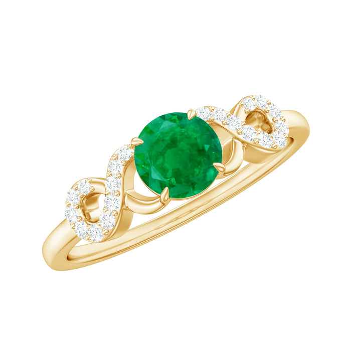 Real emerald and diamond promise engagement ring with criss-cross shank by Rosec Jewels, showcasing a detailed, elegant ring design.