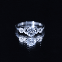 Round aquamarine and diamond infinity engagement ring by Rosec Jewels, featuring a yellow gold band and intricate design.