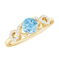 Round aquamarine and diamond infinity engagement ring by Rosec Jewels, showcasing a sparkling gemstone design with intricate band details.