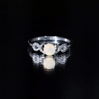 Certified Ethiopian Rainbow Opal diamond engagement ring with criss-cross shank from Rosec Jewels, showcasing vibrant colors and elegant design.