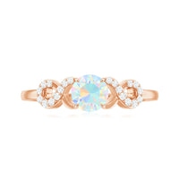 Certified Ethiopian Rainbow Opal diamond engagement ring with criss-cross shank, from Rosec Jewels, showcasing colorful opal and sparkling diamonds.