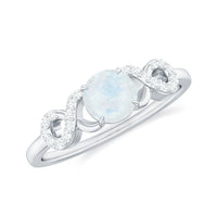 Natural moonstone solitaire ring with criss-cross diamond accents, showcasing elegant Rosec Jewels jewelry design.