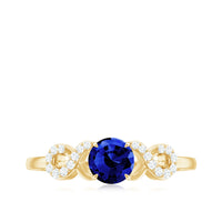 Certified 0.6 Carat Lab Grown Blue Sapphire Engagement Ring with Diamond Infinity Knot