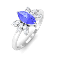 Marquise cut Tanzanite and diamond promise ring by Rosec Jewels featuring a central gemstone with surrounding smaller diamonds.