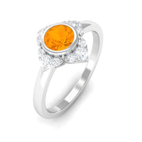 Bezel set orange fire opal flower engagement ring by Rosec Jewels with diamond accents, showcasing vibrant gemstone and intricate design.