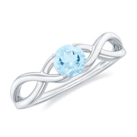 Solitaire aquamarine infinity promise ring by Rosec Jewels featuring a central aquamarine gemstone and infinity design.