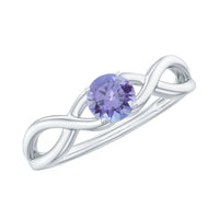 Genuine Tanzanite promise ring with crossover shank from Rosec Jewels, featuring a vibrant purple-blue gemstone and elegant band.