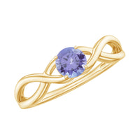 Genuine Tanzanite promise ring with crossover shank by Rosec Jewels featuring a central blue-violet Tanzanite gemstone in a silver setting.