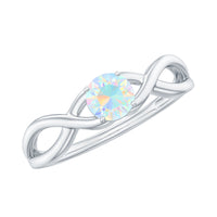 Natural Ethiopian rainbow opal promise ring with crossover shank by Rosec Jewels, showcasing vibrant multicolor gemstone and elegant design.