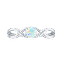 Natural Ethiopian rainbow opal promise ring with crossover shank, featuring vibrant multicolor gemstones and elegant silver band.