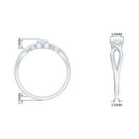Round moonstone solitaire promise ring with crossover shank in sterling silver, showcasing a polished gemstone setting.