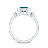 Oval London Blue Topaz Bezel Set Engagement Ring with Diamond