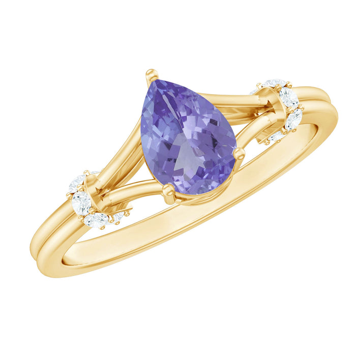 Pear-shaped tanzanite diamond engagement ring with split shank, crafted by Rosec Jewels, featuring elegant gemstone and intricate band design.