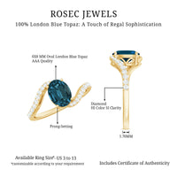 6X8mm Oval Cut London Blue Topaz and Diamond Bypass Engagement Ring