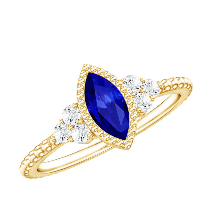 Vintage style Rosec Jewels blue sapphire marquise engagement ring with diamond trio and 0.7 carat lab-grown gemstone.