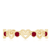 Natural ruby heart eternity ring by Rosec Jewels featuring a row of vibrant rubies set in a delicate gold band.