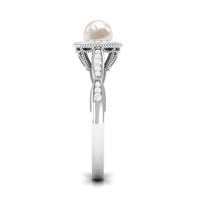 Freshwater pearl and diamond engagement ring by Rosec Jewels featuring a 2.25 CT pearl surrounded by sparkling diamonds.