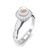 Freshwater pearl and diamond engagement ring by Rosec Jewels featuring a 2.25 CT pearl set in a delicate ring band.