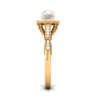 Freshwater pearl and diamond engagement ring by Rosec Jewels featuring a 2.25 CT central pearl and sparkling diamonds in a elegant ring setting.
