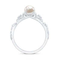 Cultured 2 carat white pearl flower engagement ring with diamond accents by Rosec Jewels, showcasing intricate floral design and sparkling gemstones.