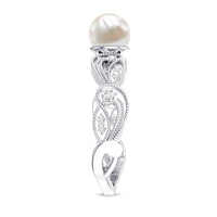 Vintage-style 2-carat freshwater pearl engagement ring with diamond accents by Rosec Jewels, showcasing intricate design and elegant craftsmanship.