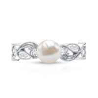 Vintage-style 2 carat freshwater pearl engagement ring with diamond accents by Rosec Jewels, showcasing intricate design and elegant craftsmanship.