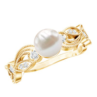 Vintage-style Rosec Jewels 2 Carat freshwater pearl engagement ring with diamond accents, showcasing intricate detailing on the band.