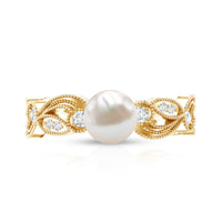 Vintage-style engagement ring with 2 carat freshwater pearl and diamond accents from Rosec Jewels, showcasing the intricate design.