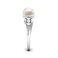 Rosec Jewels freshwater pearl solitaire ring with diamond side stones, featuring a delicate band and elegant design.