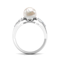 Freshwater pearl solitaire ring with diamond side stones by Rosec Jewels, showcasing a elegant pearl center with sparkling side accents.