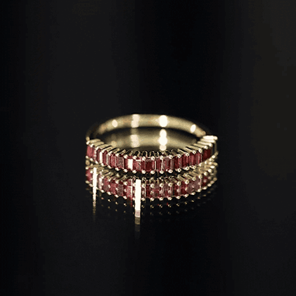 Yellow gold plated silver eternity ring with garnet baguette stones, showcasing a half eternity design by Rosec Jewels.