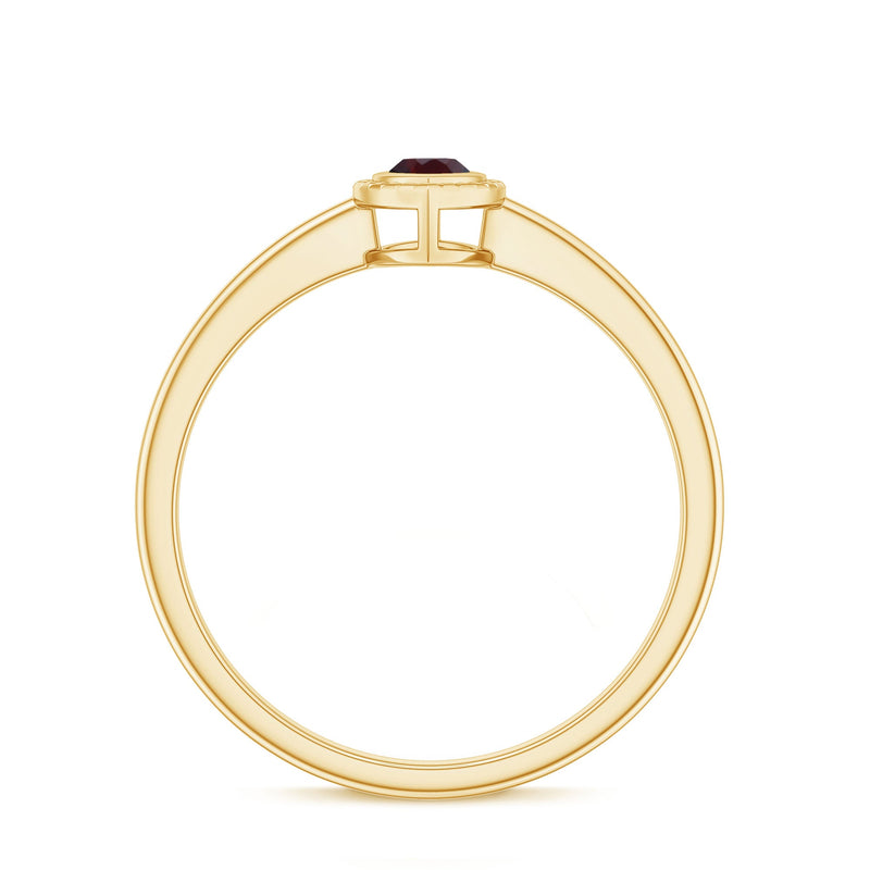 Bezel set marquise garnet promise ring in yellow gold plated silver, featuring a sparkling marquise-shaped garnet gemstone.