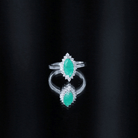 Elongated Marquise Cut Emerald Engagement Ring with Diamond Halo