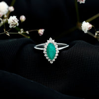 Elongated Marquise Cut Emerald Engagement Ring with Diamond Halo
