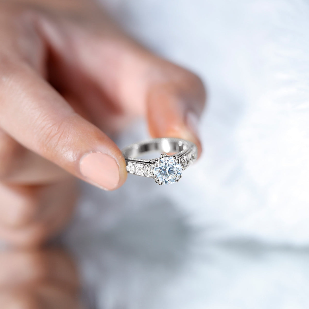 Vintage rose gold engagement ring with a 2 carat moissanite stone in a double prong setting, crafted by Rosec Jewels.